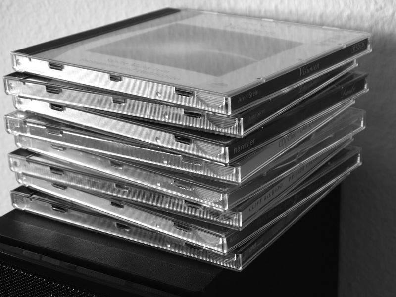 music, black and white, group of objects, box, container, focus on foreground, 5K, day, large group of objects, table, close-up, box - container, abundance