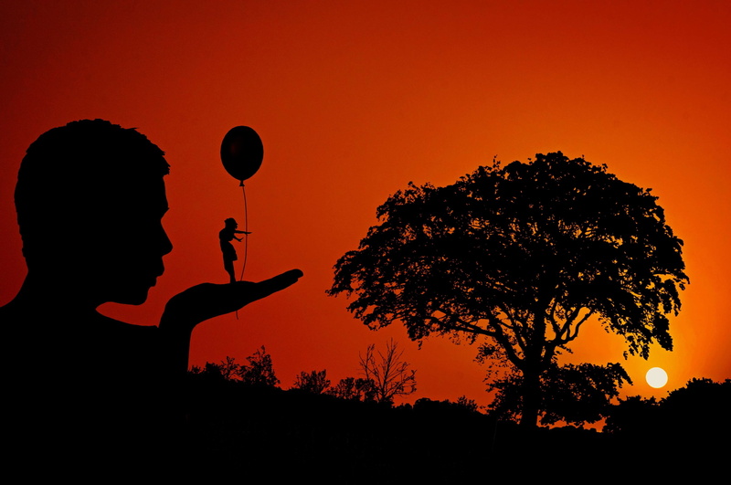 composing, outdoors, personal, human, real people, luck, one person, pair, giant, man, plant, lifestyles, adult, positive, self confidence, security, orange color
