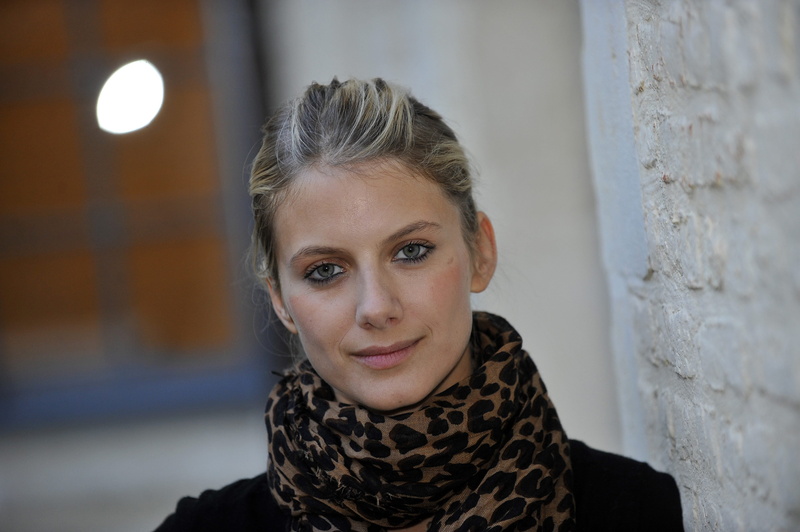 looking at camera, focus on foreground, one person, portrait, lifestyles, French, women, wall - building feature, 4K, headshot, young women, teenager