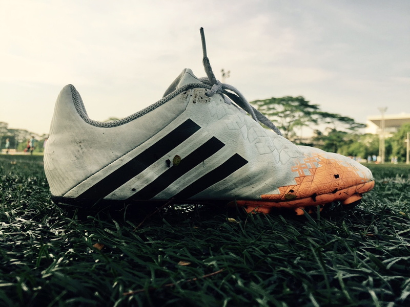 damaged, cleat, photography, cloud - sky, mode of transportation, football, old, nike, adidas, footwear, field, metal, orange, shoe, shoes, surface level