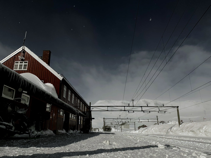 building, building exterior, 2K, winter, vehicle, architecture, cold temperature, finse, sky, covering, outdoors, train station, nature, ice, cable, locomotive