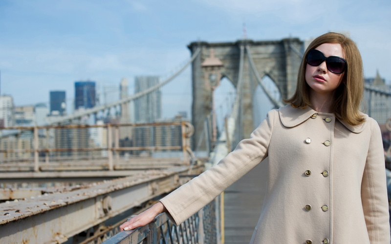 women with glasses, outdoors, one person, coats, women, building exterior, celebrity, New York City, front view, Karen Gillan, city, architecture, white coat