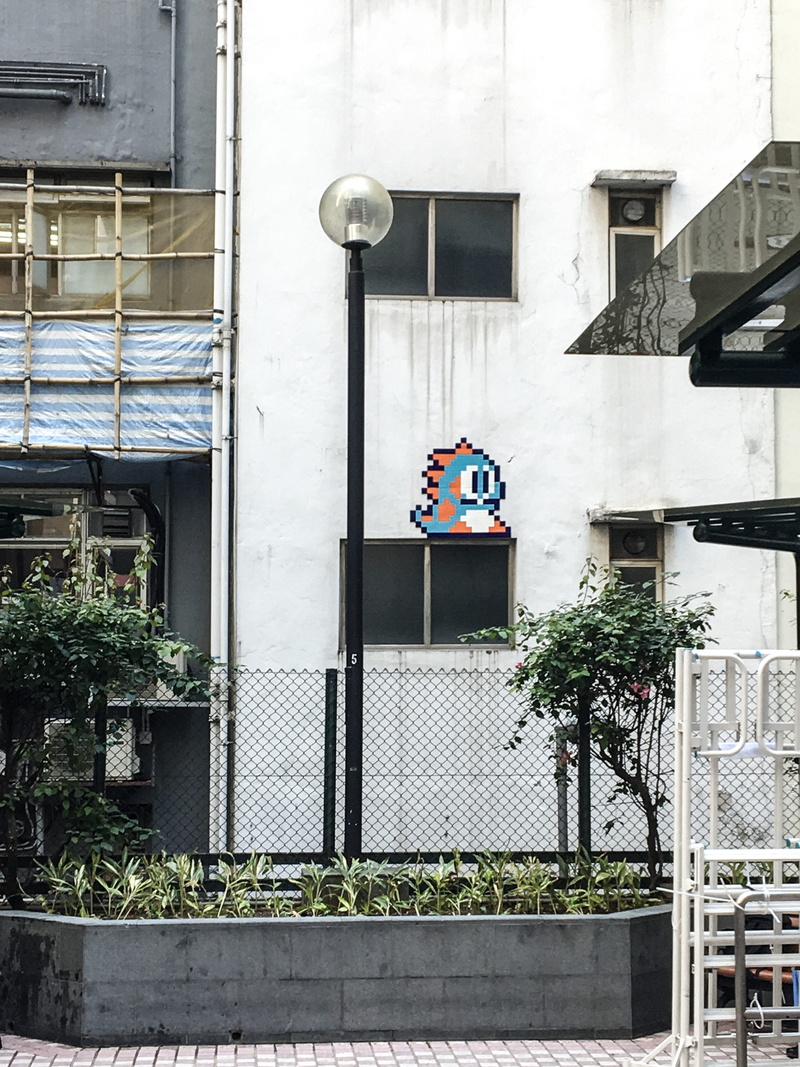 entrance, building exterior, concrete, built structure, architecture, fence, lighting equipment, tree, black, near, cyclone, plant, street, low angle view