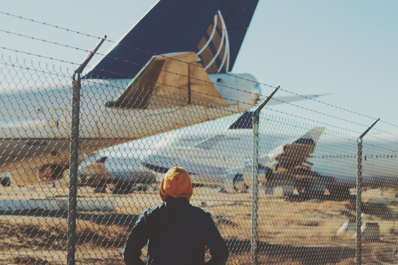 cyclone fence, barrier, aviation, 5K, person, men, urban, lifestyles, fence, steel, chain, rear view, aircraft, real people, technology, metal, barbed wire