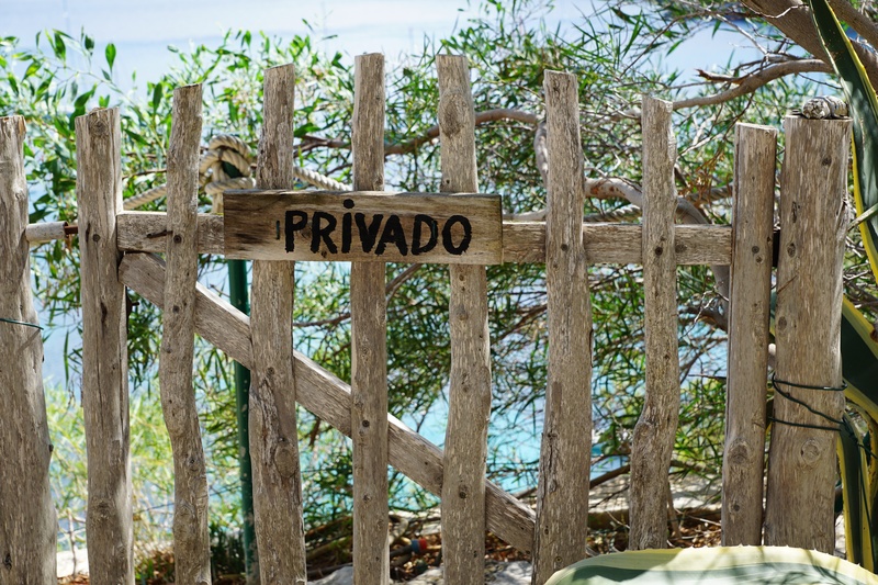 outdoors, ibiza, western script, information sign, near, grey, capital letter, day, sea, blue, brown, wealth, boundary, island, own tower, private, nature