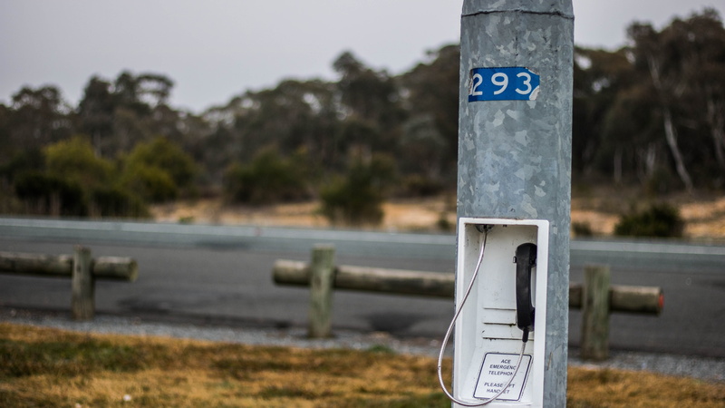 focus on foreground, plant, phone, no people, emergency, void, water, close-up, road sign, telephone, number, rest stop, 5K, information, rescue, helpless