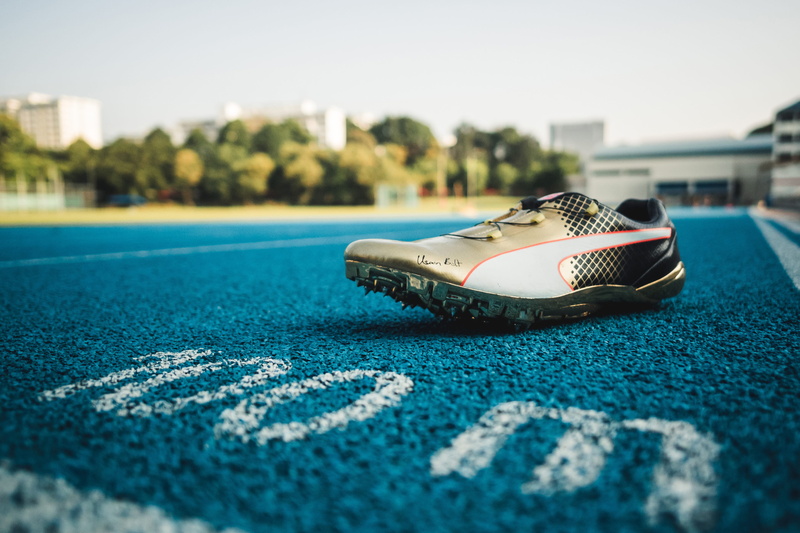 relaxation, still life, shoes, focus on foreground, sports equipment, sport, sky, architecture, no people, leisure activity, blue, sunlight, spikes, running