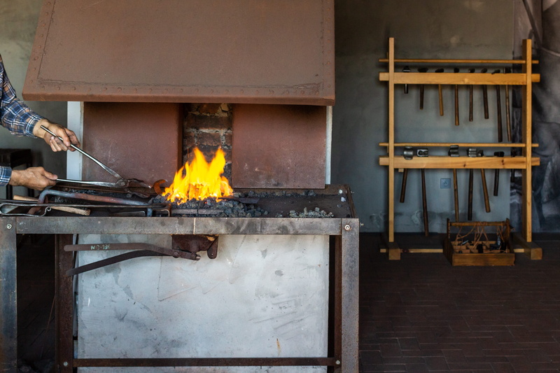 heat - temperature, forging horses, work, built structure, indoors, fire, artistic blacksmithing, occupation, blurred motion, real people, men, flame, wood - material
