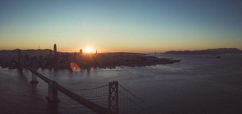 building, twilight, travel destinations, sunlight, architecture, transportation, building exterior, bridge - man made structure, skyline, city life, cisco