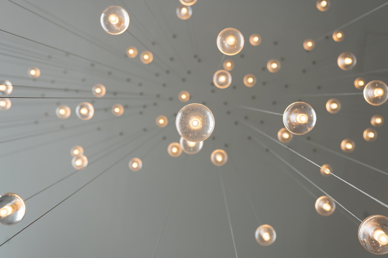 outside the box, circle, worms, indoors, shape, pendant, lighting equipment, pattern, decoration, photography, look up, power supply, low angle view, content creator