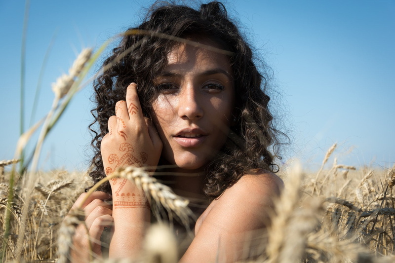 hairstyle, cereal plant, young adult, summer, outdoors, beautiful woman, hair, brunette, beauty, looking at viewer, one person, agriculture, wheat, field