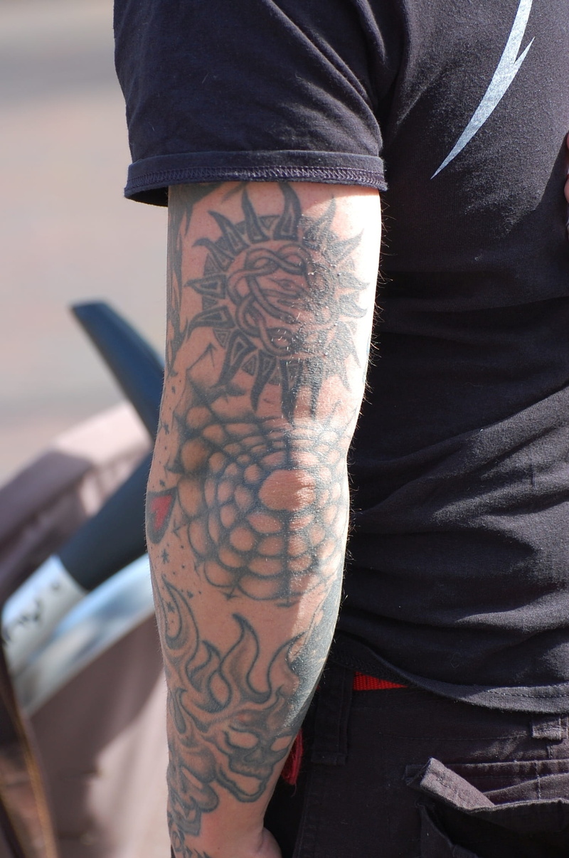 human limb, body part, focus on foreground, arm, design, man, human body part, leisure activity, midsection, dark, tattoo, pattern, one person, human hand
