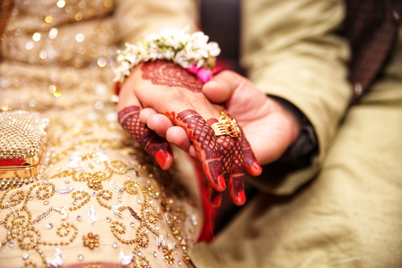 gold, close-up, body part, holding, selective focus, wedding, hand, adult, colored, couple - relationship, ring, one person, event, person, jewelry, clothing