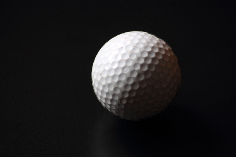 extreme close-up, no people, golf ball, golf course, black background, leisure activity, golf, white ball, play, ball, close-up, sphere, white color, studio shot