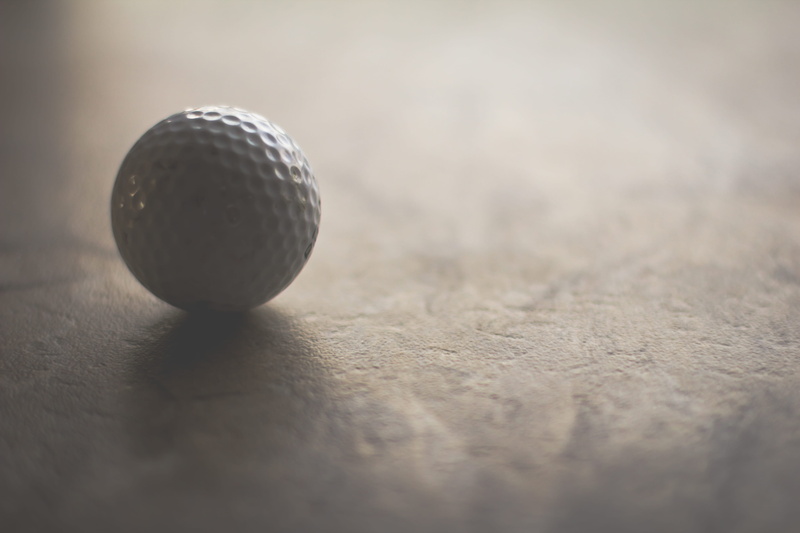 textured, sunlight, golfball, single object, outdoors, accuracy, texture, wood - material, light and shade, sport, extreme close-up, game, microphone, circle