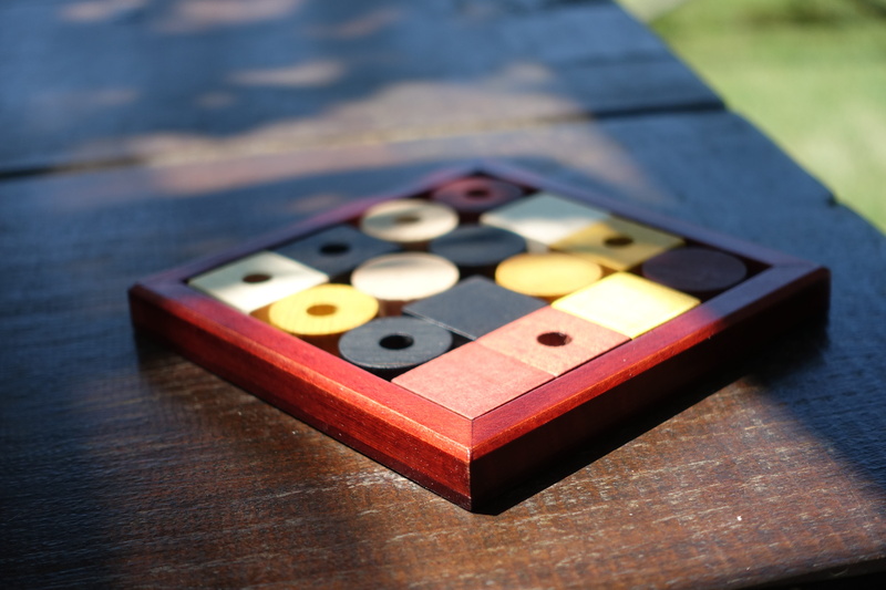 leisure activity, board game, single object, table, puzzle, chess, finish, selective focus, company, relaxation, yellow, hobby, square, leisure games, wood - material