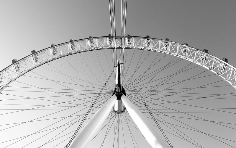 low angle view, circle, rotation, outdoors, nature, metal, large, day, fun, leisure activity, fairground, famous Place, geometric shape, sky, built structure