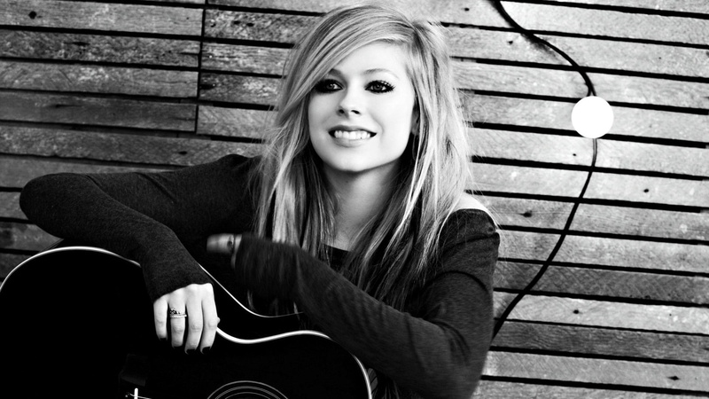 monochrome, looking at camera, musical instrument, Avril Lavigne, leisure activity, front view, mouth open, casual clothing, three quarter length, real people
