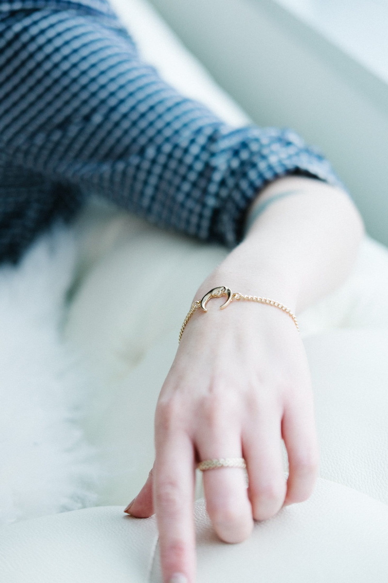s, focus on foreground, textile, body part, hand, Moon, furniture, human body part, one person, Bracelet, Ring, clothing, 1080P, women, photo, close-up