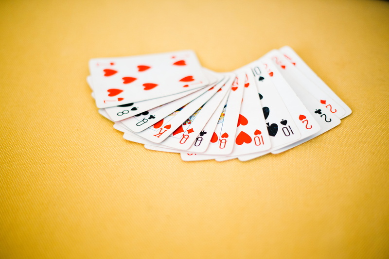 studio shot, playing, chance, spade, yellow background, indoors, leisure games, luck, relaxation, card game, close-up, gamble, numbers, playing cards, number
