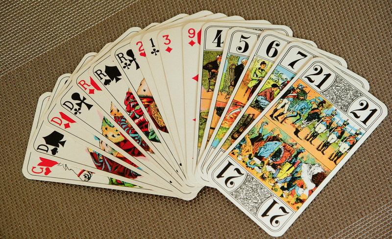 number, player, opportunity, gambling, no people, indoors, choice, leisure games, variation, communication, art and craft, fan, playing cards, text, high angle view