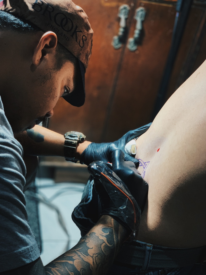 young adult, adult, mid adult, people, armored, person, star symbol, tattooing, pub, creativity, clinic, finger, man, males, bar counter, military, back