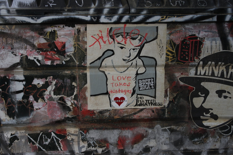 Hollywood, Love, representation, text, western script, graffiti, paint, day, wall - building feature, built structure, politics, paper, poster, Hostages