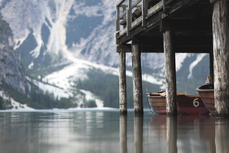 outdoors, boathouse, blur, built structure, non-urban scene, day, wood - material, architecture, no people, waterfront, boat, reflection, transportation