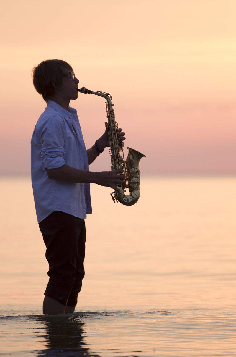 men, sunset, lifestyles, real people, outdoors, nature, leisure activity, saxophone, beauty in nature, golden, the baltic sea, sea, playing, hour, male