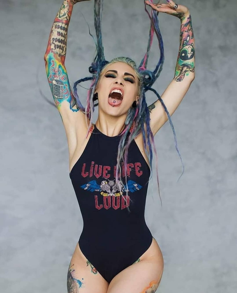 makeup, simple background, swimwear, women, closed eyes, long hair, tongue out, tattoo, black clothing, open mouth, dyed hair, 720P, piercing, model, eyelashes