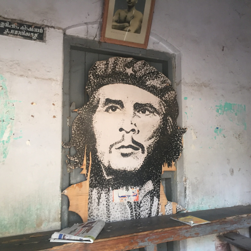 one person, lifestyles, poster, graffiti, real people, socialist, india, guevara, day, female likeness, che, window, art and craft, c.c. 2/481, revolutionary