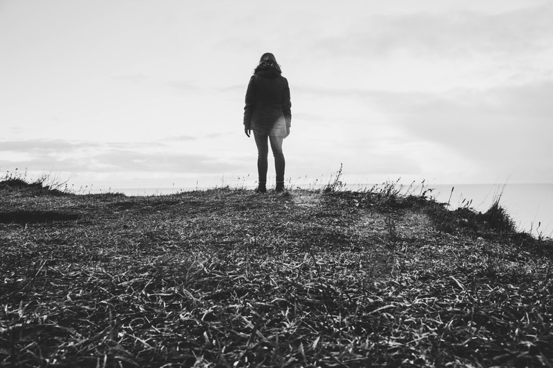 women, fog, grass, black-and-white, tranquility, cloud - sky, walking, hood - clothing, person, 5K, standing, day, coat, leisure activity, plant, outdoors