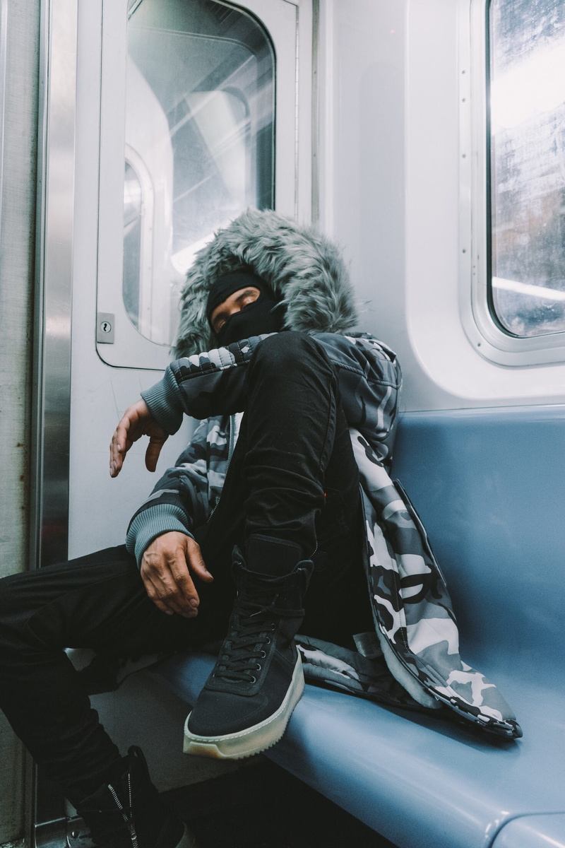 vehicle interior, one person, male, metro, coat, train, subway train, journey, lifestyles, public transportation, leisure activity, land vehicle, outdoors