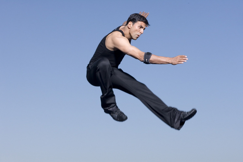 young men, low angle view, leisure activity, outdoors, motion, sky, effort, kumar, profile view, day, jumping, action, copy space, mid-air, nature, one person