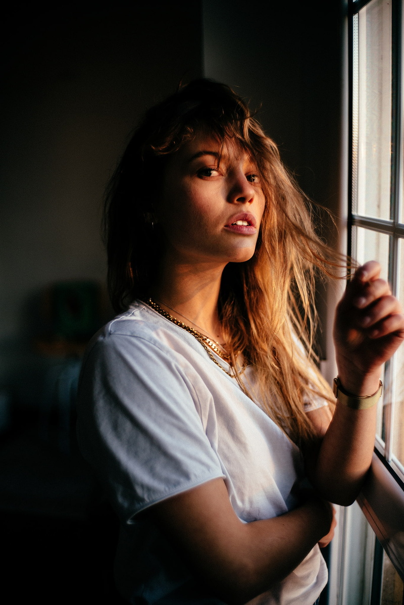sadness, frowning, women, beautiful woman, hairstyle, contemplation, brunette, one person, waist up, beauty, white t-shirt, hands in hair, adult, emotion