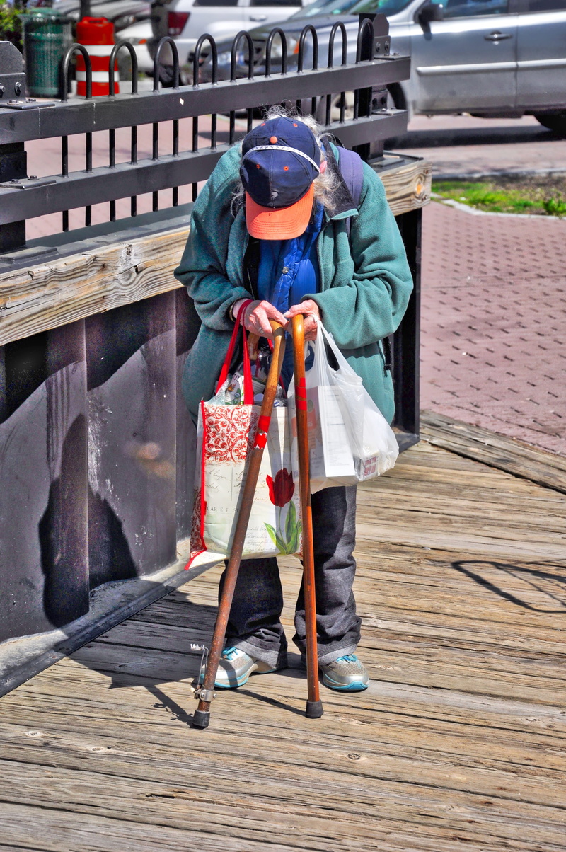 walking, day, full length, baseball hat, Mature, holding, one person, female, real people, second hand, architecture, working, grandmother, railing, care