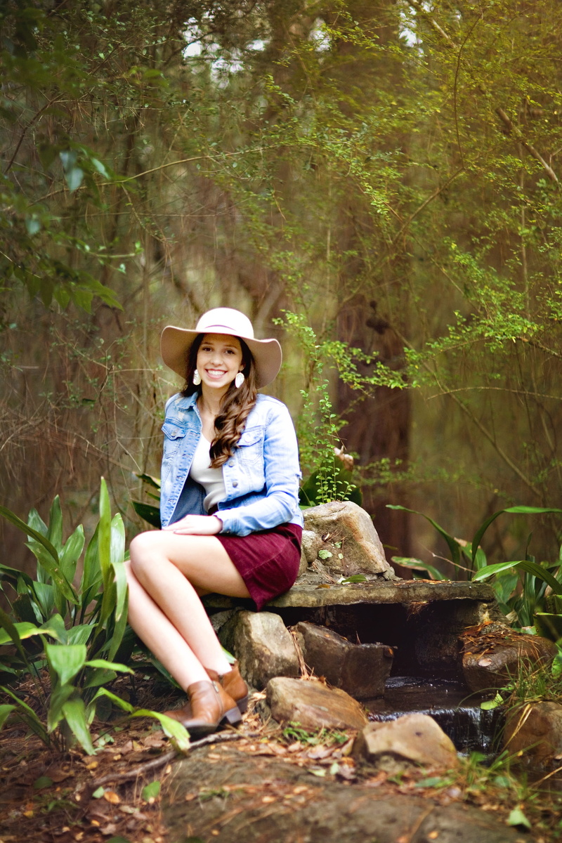 full length, Outdoors, one woman only, only women, 4K, lifestyles, sitting, front view, cute, adults only, young, hat, looking at camera, tree, nature