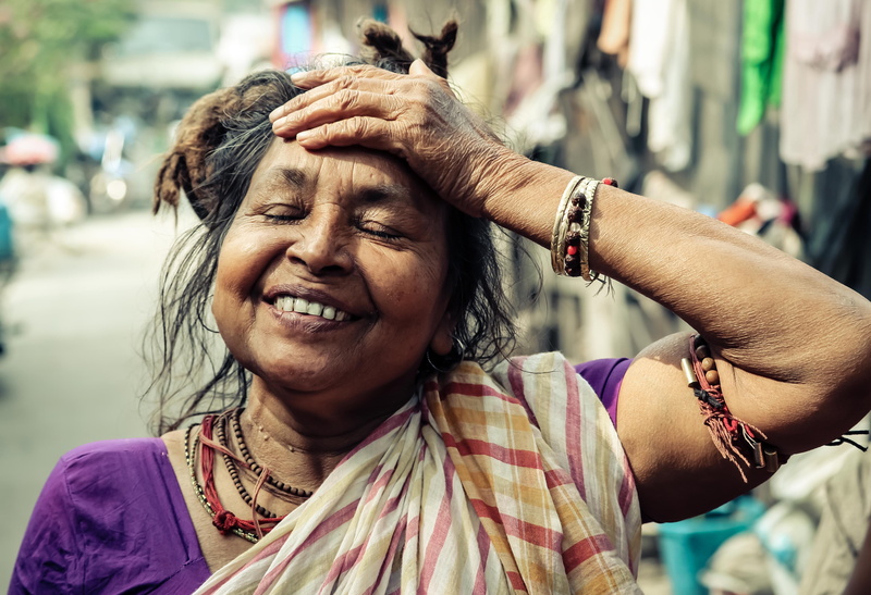 india, focus on foreground, lifestyles, social issues, smiling, adults only, people, women, real People, photo, city, outdoors, human Face, one Person