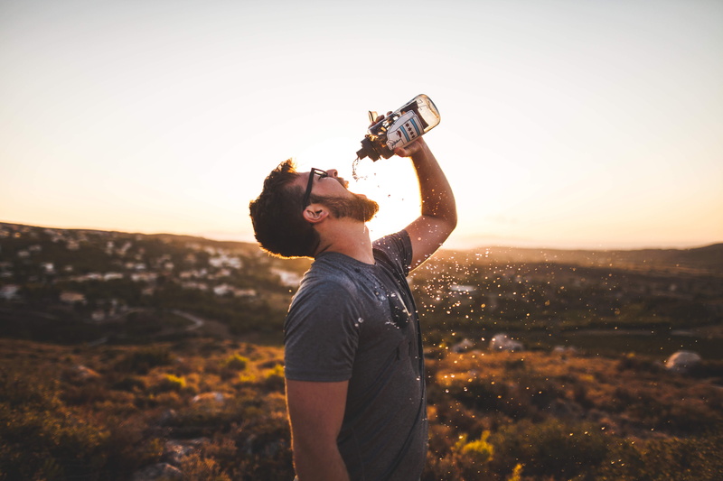 young adult, outdoors, guy, nature, drinking, casual clothing, holding, tshirt, only women, one woman only, man, 5K, sunshine, side view, leisure activity