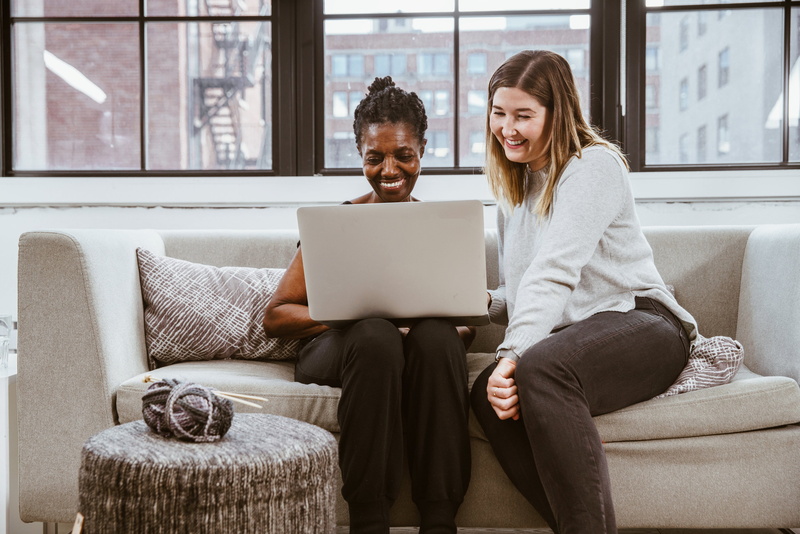happiness, sitting, Senior, smiling, Diversity, domestic room, adult, Mom, using laptop, Teacher, learning, furniture, Technology, Community, connection