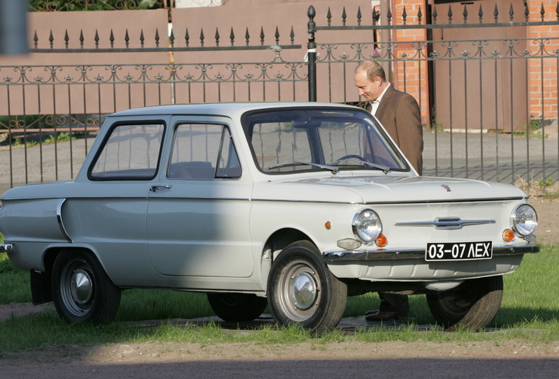 collectors Car, one person, building exterior, machine Putin, 2K, senior Adult, land Vehicle, old-fashioned, men, coupe, car, travel, antique, President