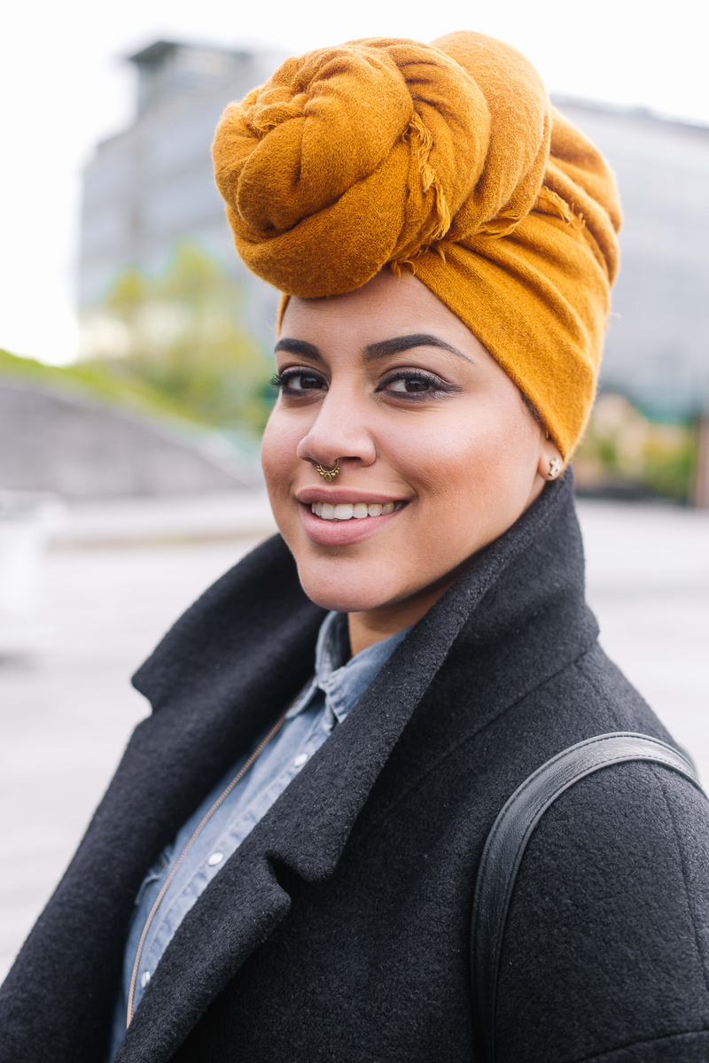 nose piercing, blur, warm clothing, young adult, depth of field, city, pretty, happiness, female, photoshoot, looking at camera, pose, looking, woman, person
