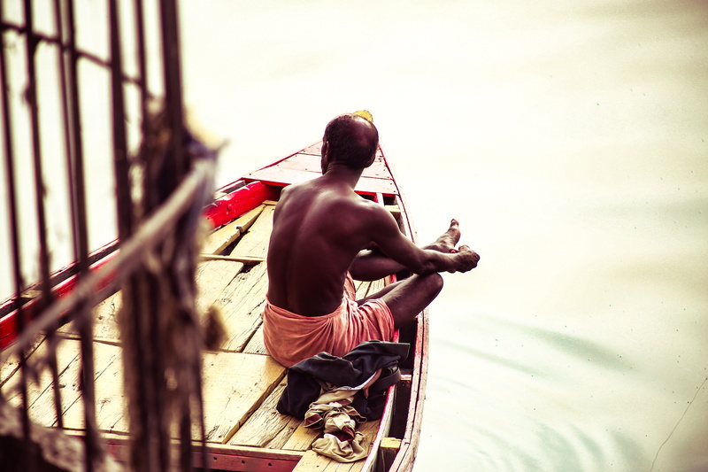 river, real people, 5K, sitting, india, transportation, rear view, boatman, male, shirtless, river ganges, day, mode of transportation, contemplating
