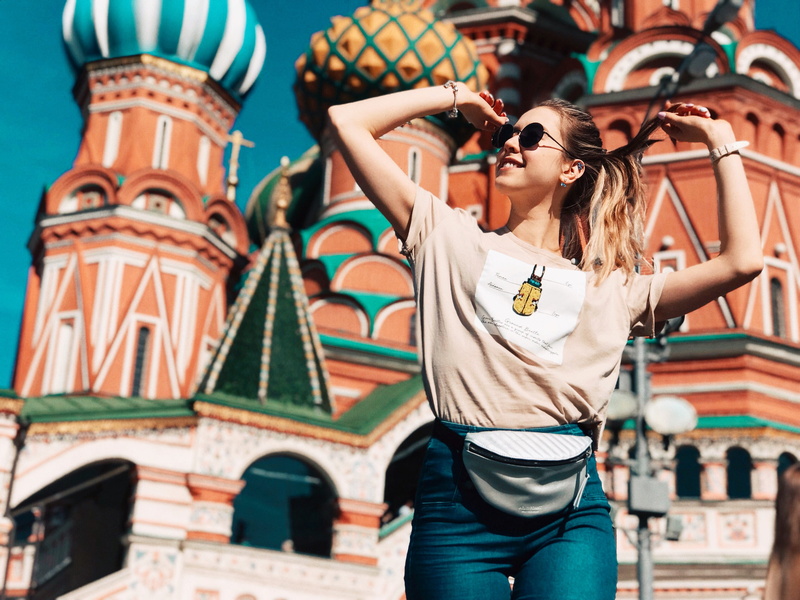hairstyle, beautiful woman, front view, 2K, low angle shot, photo, posing, glasses, red square, hands up, young adult, russia, lifestyles, standing, beauty