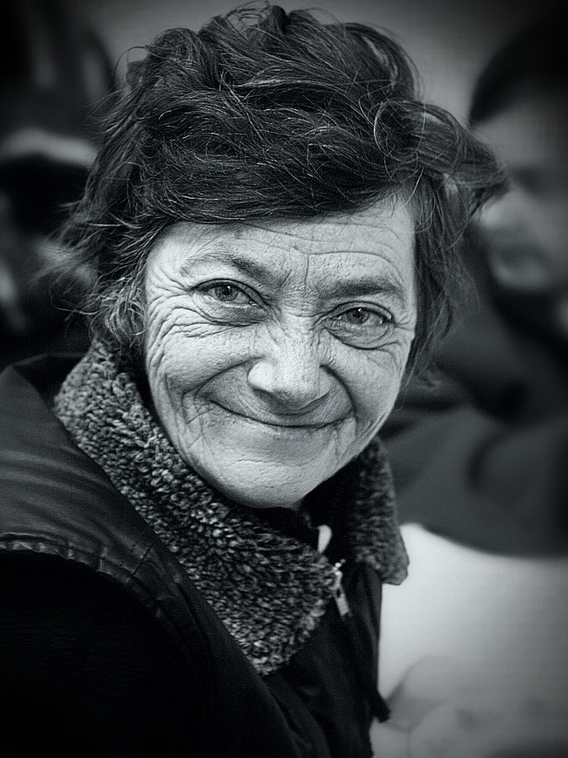 headshot, emotion, senior adult, human, front view, 2K, clothing, portrait, poverty, focus on foreground, warm clothing, street, eyebrow, senior women