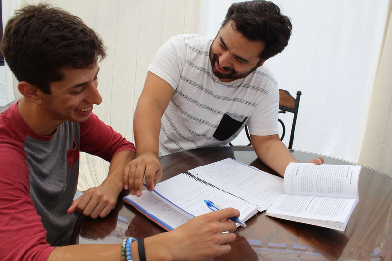 2K, study, sitting, mid adult men, togetherness, young men, mid adult, indoors, adult, casual clothing, tutor, table, people, teamwork, paper, young adult
