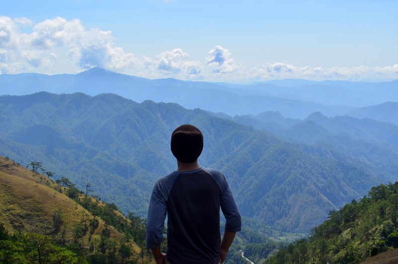 looking at view, tranquility, outdoors, mountain, travel, nature, environment, beauty in nature, non-urban scene, idyllic, sky, tuba, men, real people