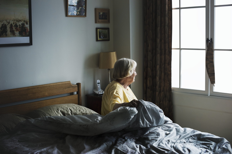bed, day, bedroom, inside, one person, hairstyle, window, contemplation, casual clothing, woman, 5K, leisure activity, senior adult, lifestyles, room