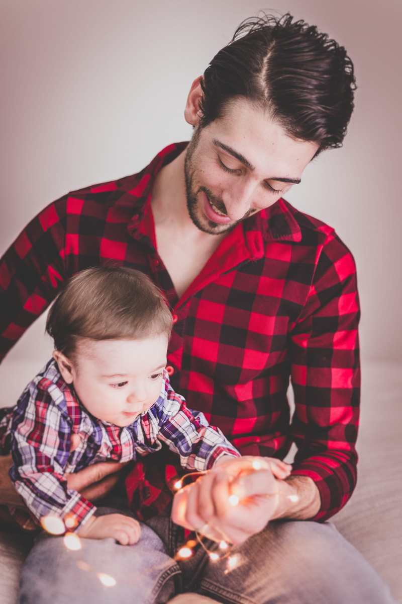 son, wearing, black, cute, men, innocence, casual clothing, baby, indoors, shirt, real people, sit, males, affection, looking, togetherness, child, bonding