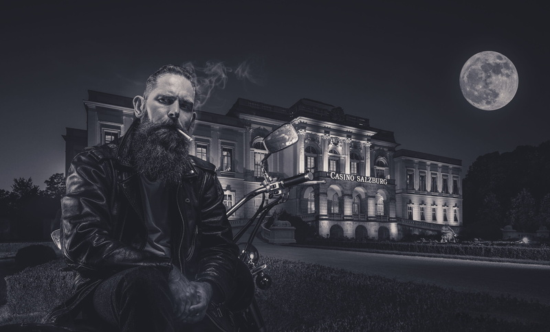 one person, architecture, casino, front view, sky, 2K, mouth open, mid adult men, evening, males, full moon, biker, built structure, building, moon, aggression